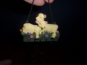 New Lamb chimes 2 lambs are standing in grass w flowers design on front & back