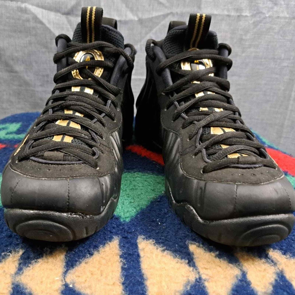 black and metallic gold foamposites