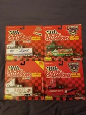 RACING CHAMPIONS TEAM TRANSPORTER .Lot of 4