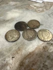 lot (d) 5 ungraded, circulated peace dollars