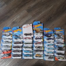 Hot Wheels 32 Car Lot Brand New Never Opened so cards have bends most from 2017