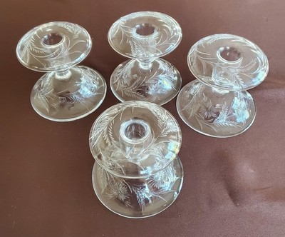A set of four Vintage Pairpoint Intaglio Cut Glass Candle Holders