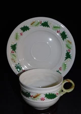 BELLEEK HOLLY AND RED BERRY CUP & SAUCER
