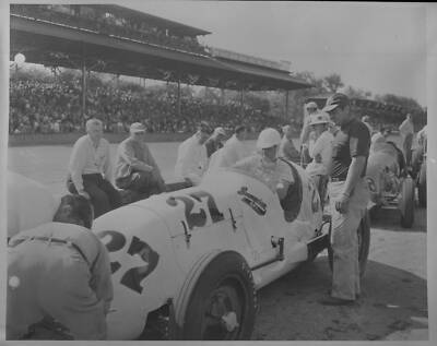 Walt Ader sits in the #27 Sampson Special as crew members surro 1950 Indy Photo