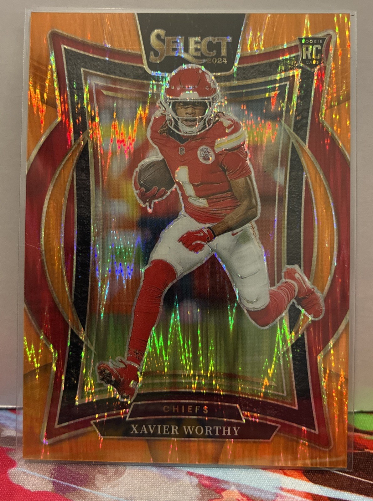 2024 Panini Select - Concourse Xavier Worthy #32 Orange Shock Prizm /499 (RC)