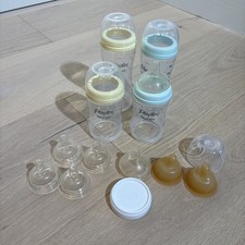 Set of Four Playtex Nurser Bottles, 4 oz and 8 oz, with 8 nipples, 1 flat lid.