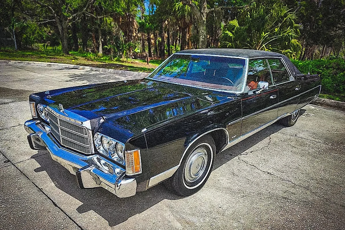 Left front profile of a black 1975 Chrysler New Yorker