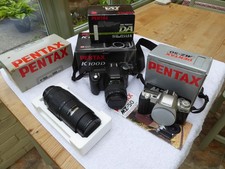 Pentax K K100D and Pentax MZ50 cameras with lenses