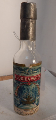 vintage old bottle corker-Florida water  L & E Himkrs New York paper label