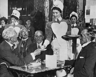 Lyons tea shop Piccadilly London A waitress serves her customers T- Old Photo