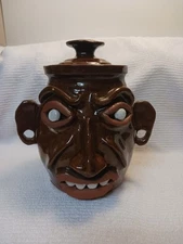 Folk Art Face Pottery Jug with Lid Signed H. 2011