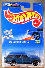 1996 Hot Wheels Blue/White Card #606 MERCEDES 300TD Green w/Chrome 5 Spokes