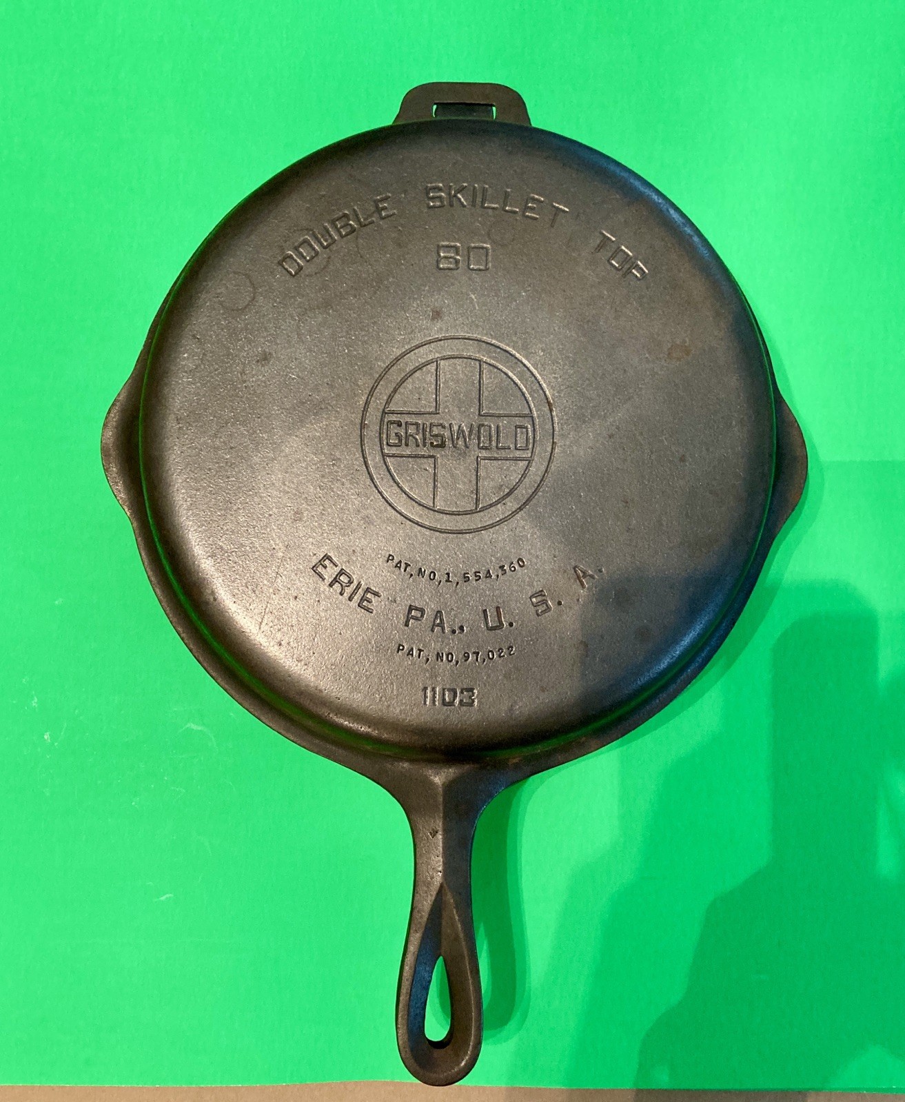 Antique Griswold No. 80 hinged double cast iron skillet, open.