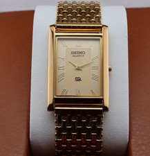 Vintage Seiko Slim Quartz Men's Wrist Watch Gold Dial with Gold Bracelet.