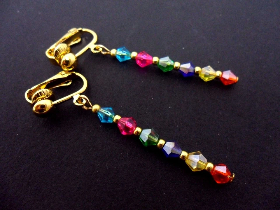A PAIR OF RAINBOW CRYSTAL GLASS BEAD GOLD PLATED CLIP ON EARRINGS. NEW. - Image 1 of 1