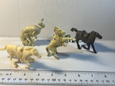 Lot of four VTG Marx Western horses from different sets.