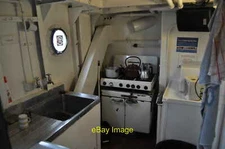 Photo 12x8 Mincarlo Trawler - Galley A view of the small Galley dining roo c2011