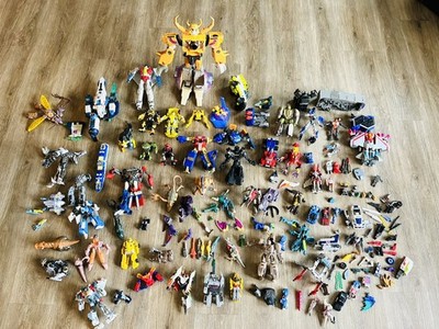 Transformers toy lot full of weapons parts and pieces