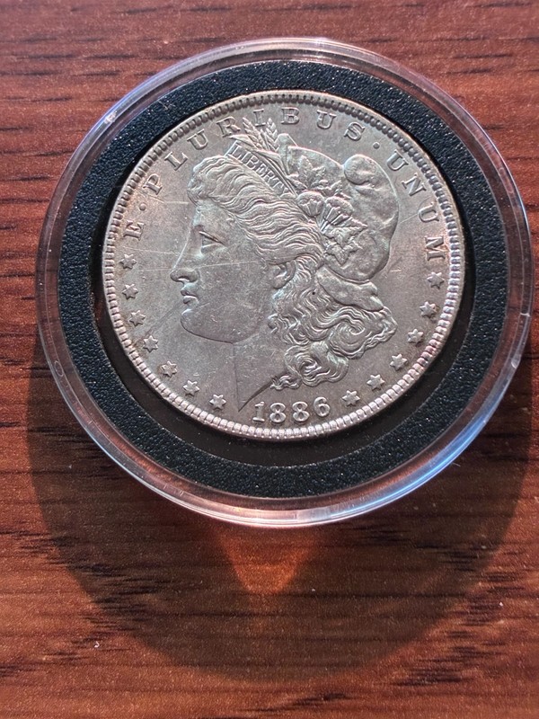 1886 $1 Morgan Silver Dollar - Almost Uncirculated