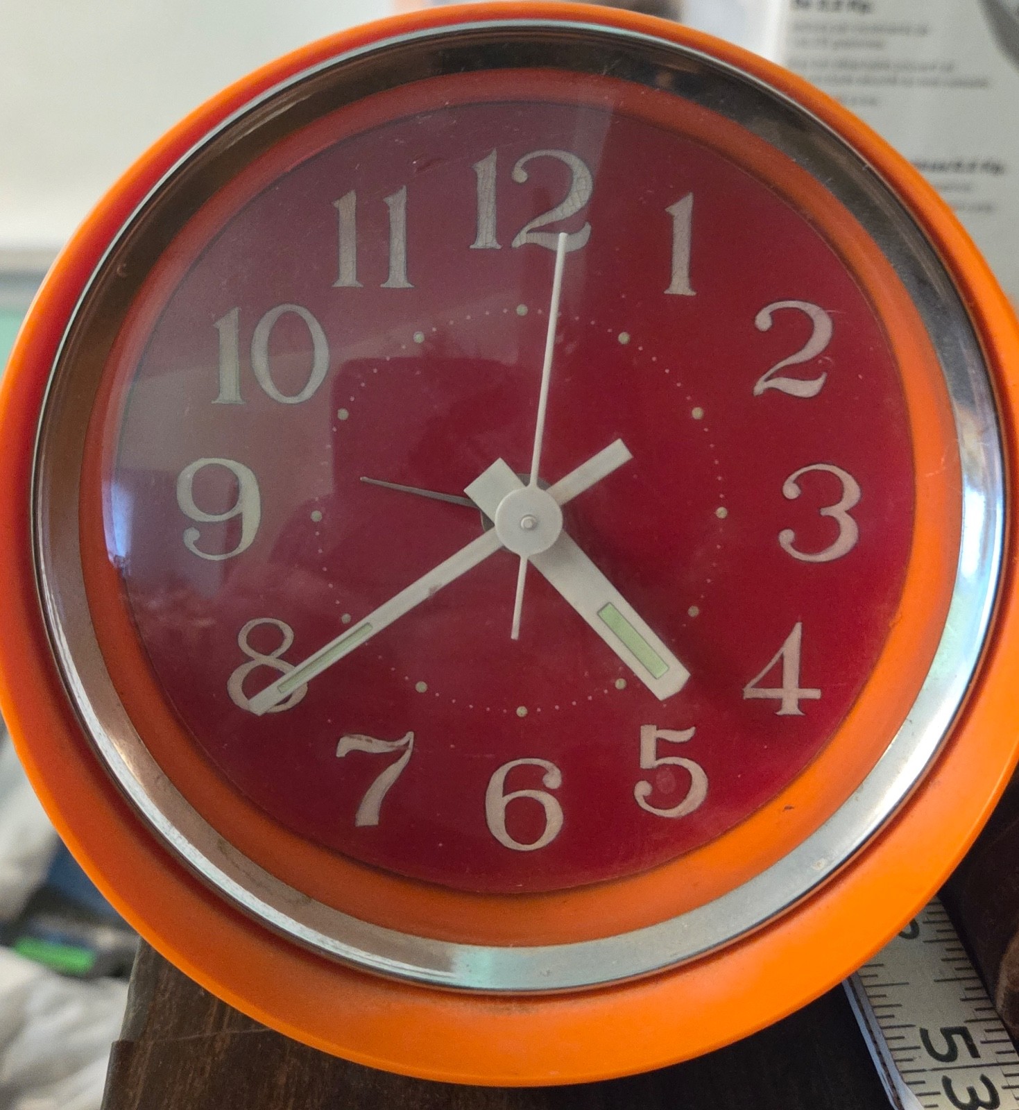Mechanical orange colored clock. Japan. Plastic. 4.5 x 3.25 inches. Runs well.