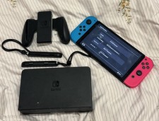 Nintendo Switch OLED with Joy Con Grip, Joy Con Bumpers and Docking Station