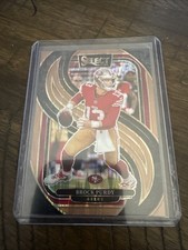 2024 Panini Select - Premier Level Brock Purdy #124 Copper Shock Prizm #1/299