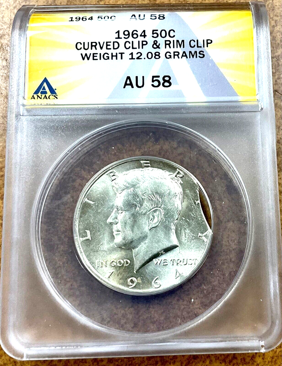 1964 JFK Kennedy Half dollar 50c. ERROR ANACS AU58 CURVED CLIP