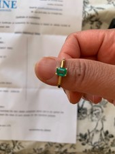 18 carat gold ring with emerald engagement.   Valued at £2000