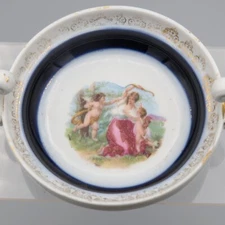 German Handled Hand Painted Cherub Gilt Salt Cellar Nut Dish