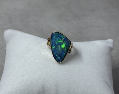 Natural Australian boulder opal with A 14k Gold ring And Diamonds. Ring size 8.