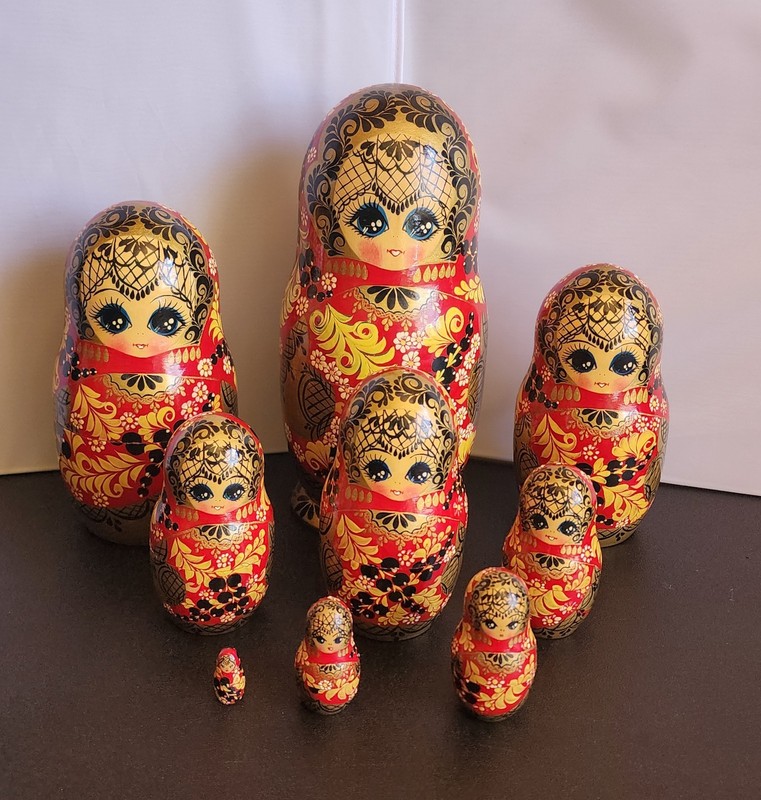 Vintage 9-piece set of Hand-painted Russian Nesting Matryoshka Dolls 