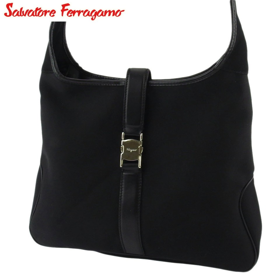 A pre-owned Salvatore Ferragamo one-shoulder bag in striking black/silver — designer heritage meets sustainable secondhand chic.