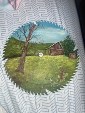 hand painted sawblade with country landscape