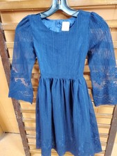 A. Girls Dark Blue Dress With Design At Bottom And Sleeves Very Pretty