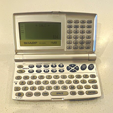 Sharp YO-520 Electronic Organizer TESTED/Works. Has a crack, good for parts.