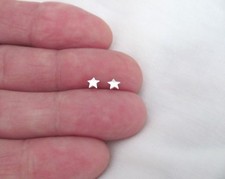 Sterling Silver 4mm tiny slightly rounded plain Stars post stud earrings.