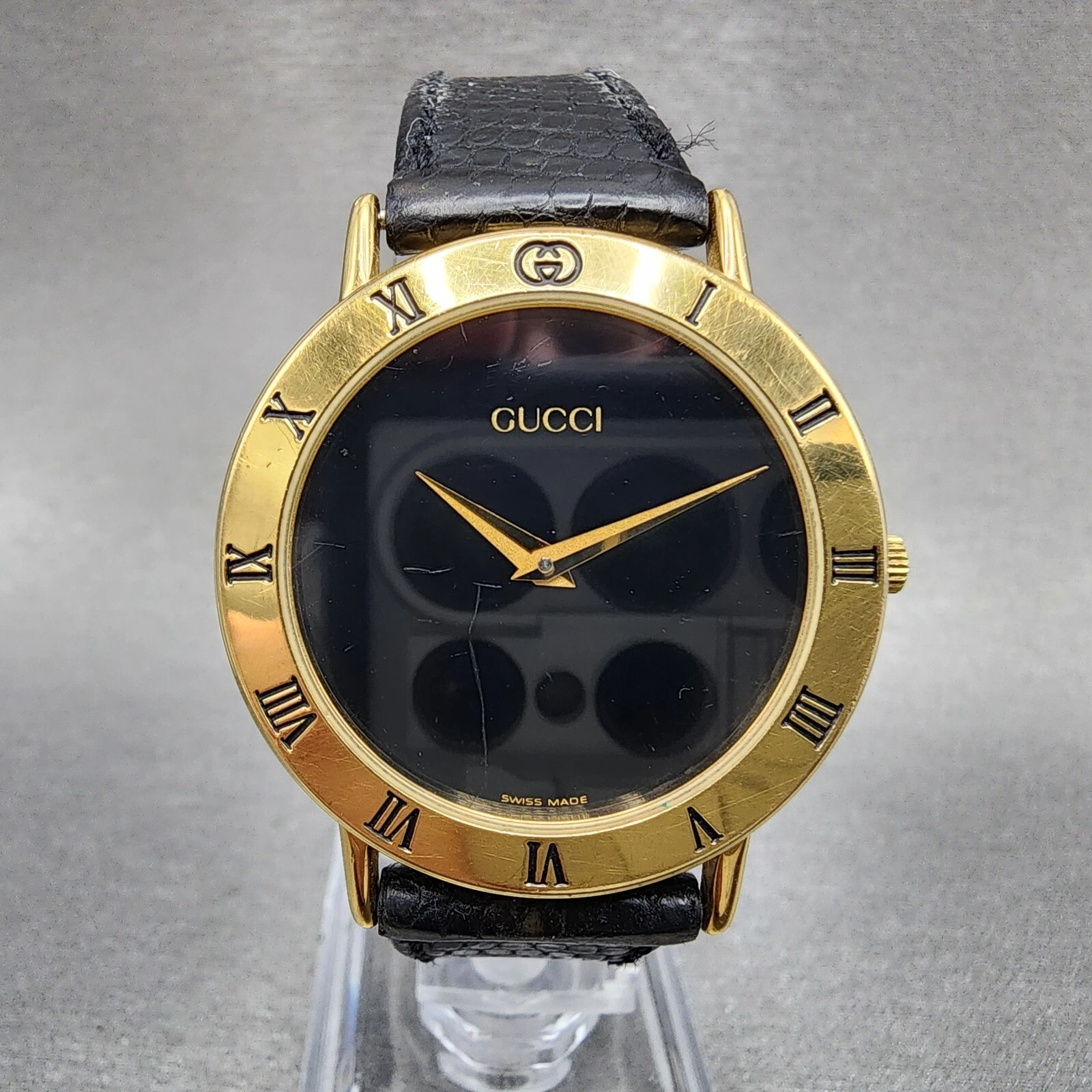 Montre Gucci 3000M homme 33 mm cadran noir plaqué or bracelet cuir rond pile neuve