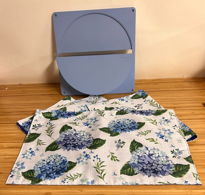 Tupperware  Light Blue Lid Wall Holder  and 4 floral material place mats