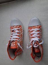 Womens orange and white tiger-striped high-top canvas sneakers
