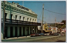 W Main St Grass Valley CA - Holbrooke Hotel & Sears & Alpha Hardware - Postcard