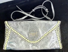 Guess Sling/Clutch Purse Pre-Owned Great Condition.