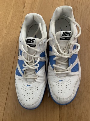 white nike trainers blue tick