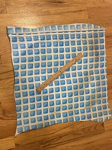USED LARGE SQUARE INTEX POOL LINER PATCH - MEASURES ABOUT 20 INCHES BY 19 INCHES