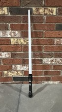 Star Wars toy lightsaber features a black hilt with silver detailing - E