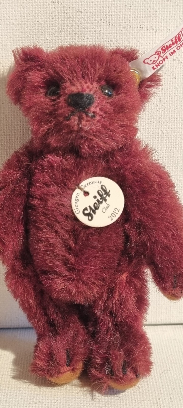 Ours en alpaga bordeaux STEIFF-Club 2012, un mini-ours articulé de collection