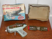 Vintage P-47 Thunderbolt Cap Firing Tin Fighter Plane in Box .