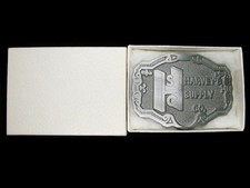 TD07160 NOS VINTAGE 1986  HARVEY'S SUPPLY CO.  ADVERTISEMENT BELT BUCKLE
