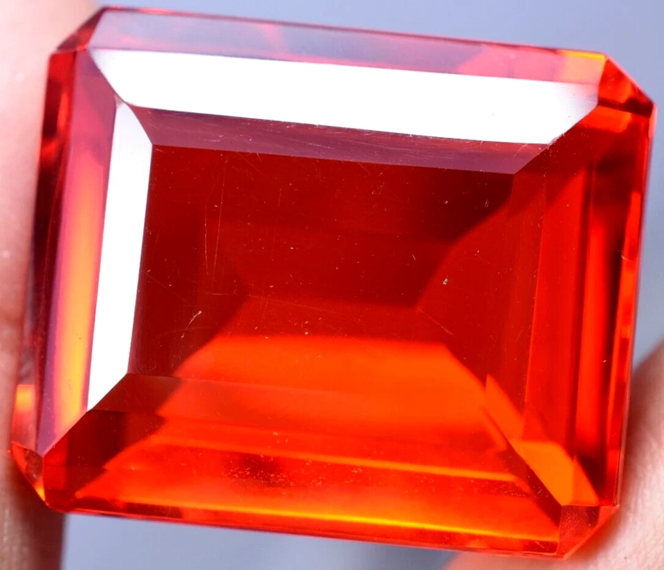 Lab created 128.05 Ct Splendid Orange Topaz GGL Certified Emerald Cut Gemstone Foto 3 de 4