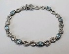 Infinity Tennis Bracelet 7.75" Sterling Silver Blue Topaz