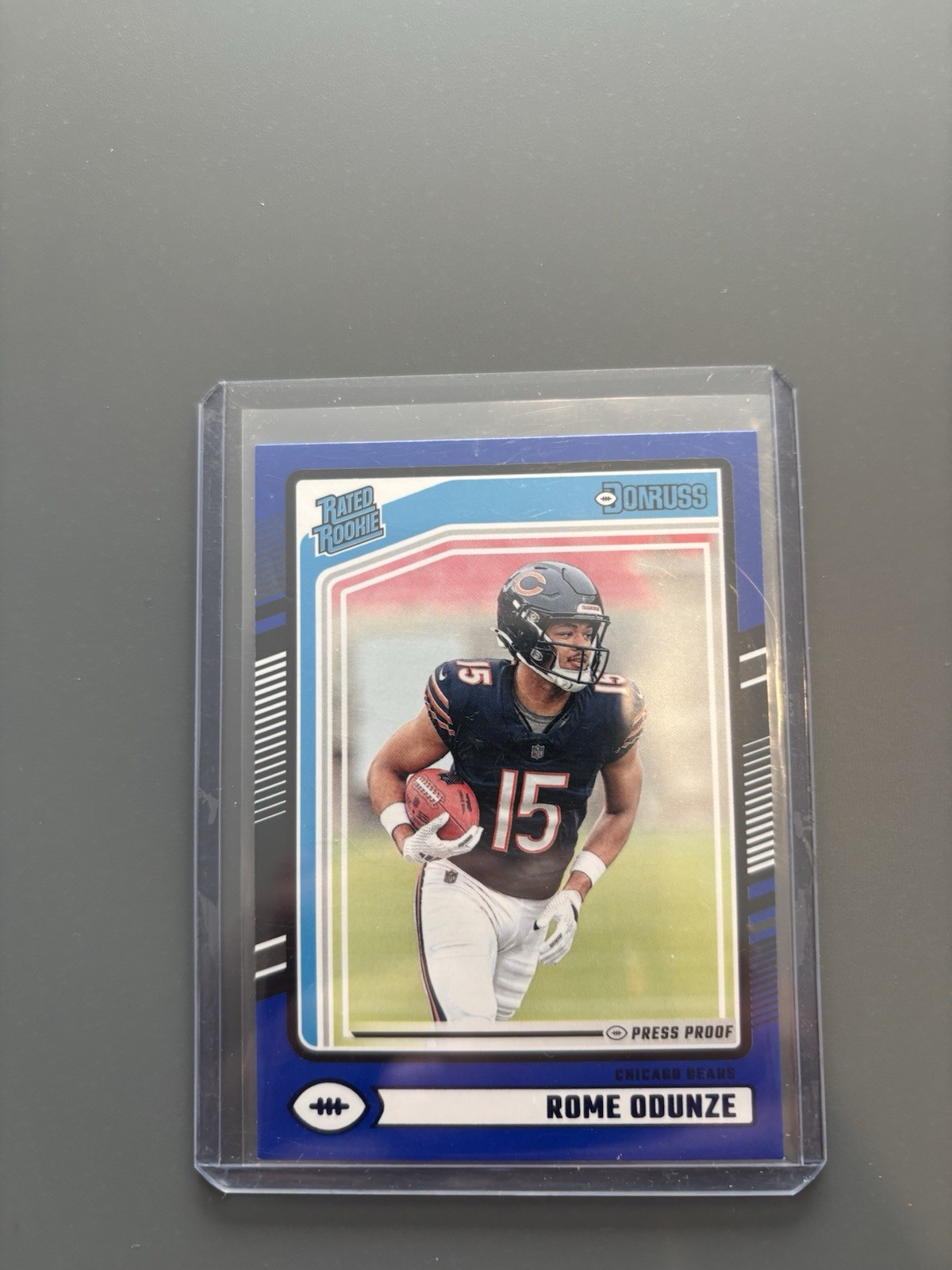 2024 Donruss #309 Rome Odunze Rated Rookie Press Proof Blue Chicago Bears